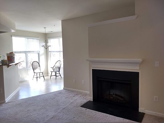 Electric fireplace with blower warms up cool evenings.