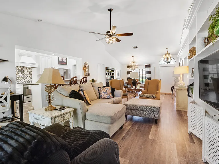 Light and bright throughout this very large living space, family room, dining area, bar area, kitchen and work space.