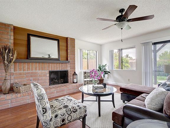 Family Room with Fireplace and quick access to backyard