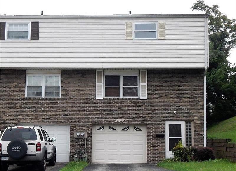 BRICK AND SIDING END UNIT THREE BEDROOM TOWNHOME WITH A DEEP ONE CAR INTEGRAL GARAGE.
