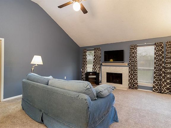 Beautiful wood burning fireplace with view of spacious back yard