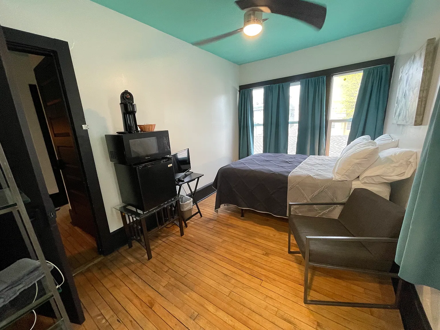 Bedroom 5 from the West | TV, mini fridge, and TV (TV has since been mounted to wall)