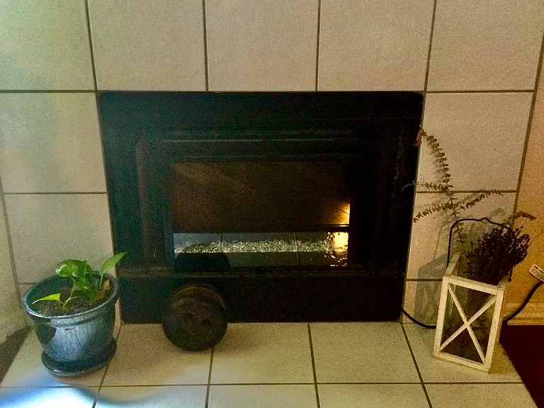 Working fireplace in family kitchen.