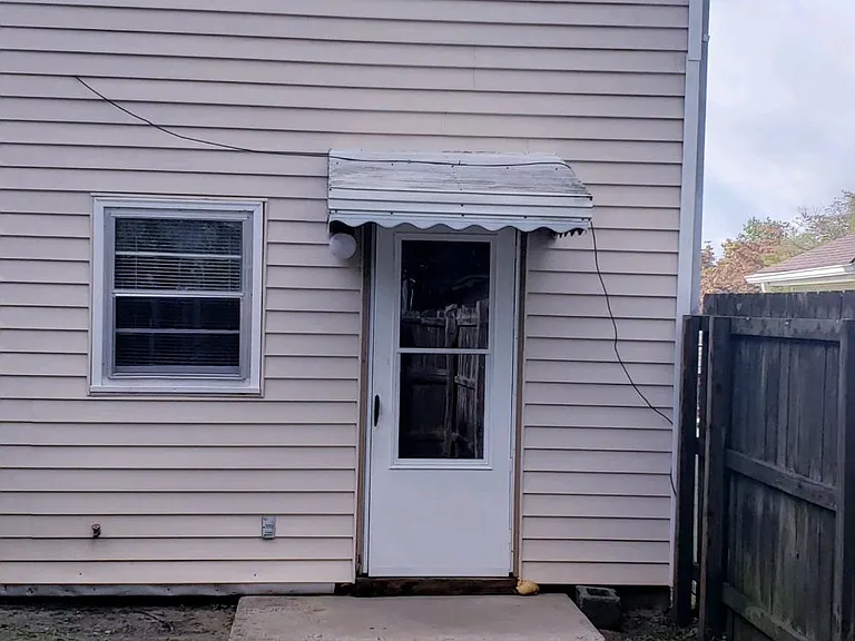 Completely enclosed - backyard/rear property view.