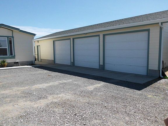 3 Car Garage with attached workshop.