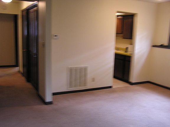 Main room looking left down the hall & kitchen entrance.