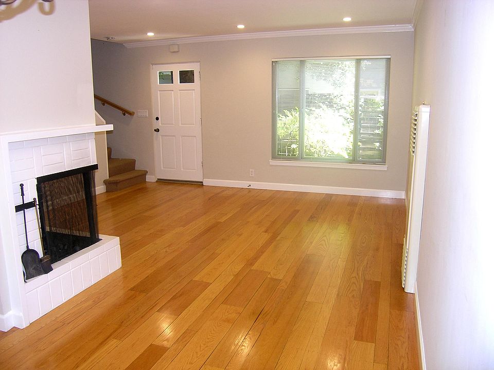 Looking toward the living room and front door from standing in the dining area.
