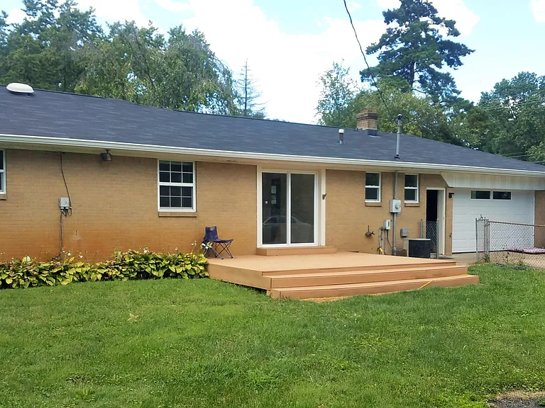 Fenced backyard with deck & attached garage