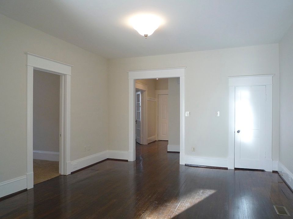 View from kitchen into living room, master bedroom on the left