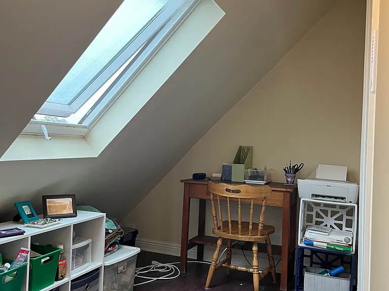Landing on the 3rd floor at the top of the stair case. Two skylights provide natural light to the stairs and the landing.