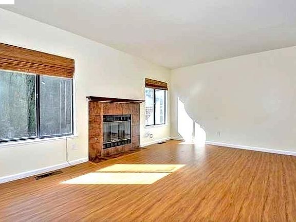 Open Living Room with plenty of natural light. Recess ceiling lights added recently. Gas fireplace. Central Air-condition and heat across the house.