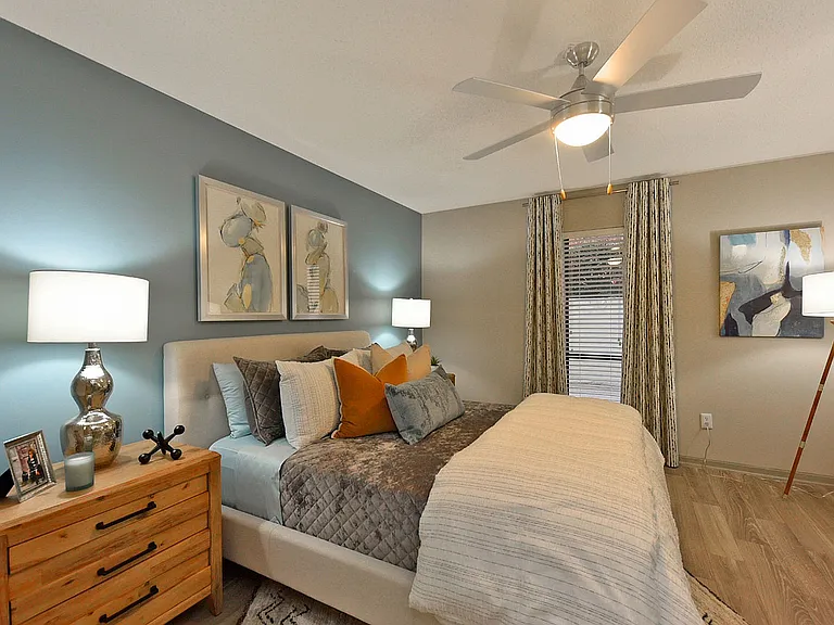 Bedroom with hardwood-style flooring