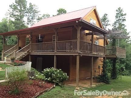 House with Covered Deck and Pergola
						:
						Nearly 60' of decking including Pergola
Stained Concrete siding
Metal roofing