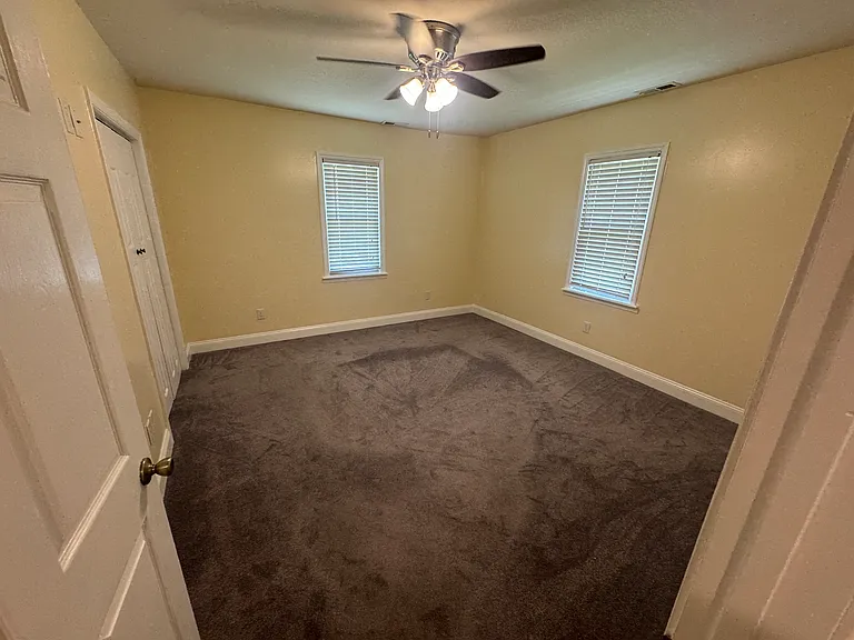 Primary bedroom _ Spacious bedroom with ceiling fan and closet