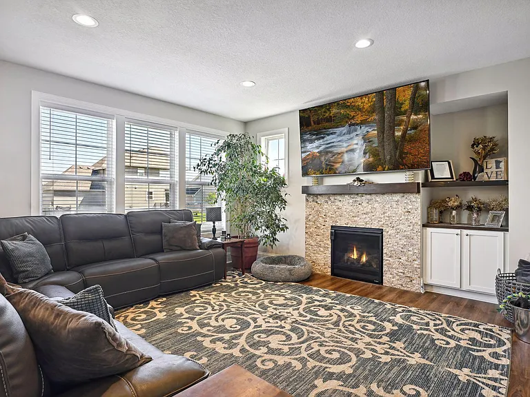 Large and bright living room with gas burning fireplace