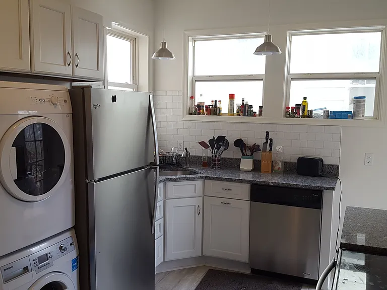 Granite countertops, dishwasher, and washer/dryer.