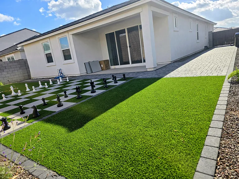 Fully furnished backyard with:
-Built-in patio
-Paver for additional parking
-In ground Chess pattern turf