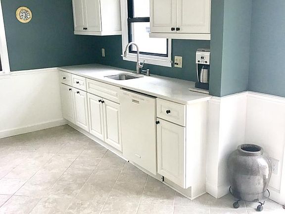 Updated Kitchen with New cabinets and quartz countertops. Pull out trash/recycling and soft close doors.
