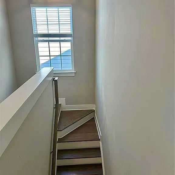 Stairs to additional full bath, bedrooms and loft