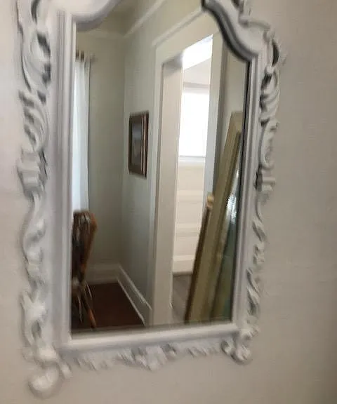 Vintage, ornated hand carved framed mirror