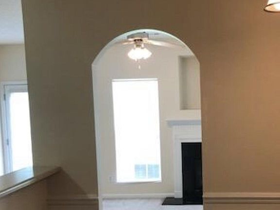 Kitchen opens to a cozy dining room, kitchen , and a warm and cozy family room with fireplace that overlooks a wooded lot.