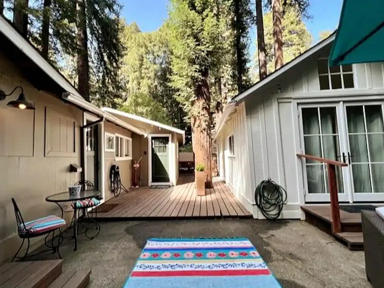 View from the concrete backyard toward the front of the property.