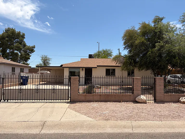 Gated yard with lots of parking