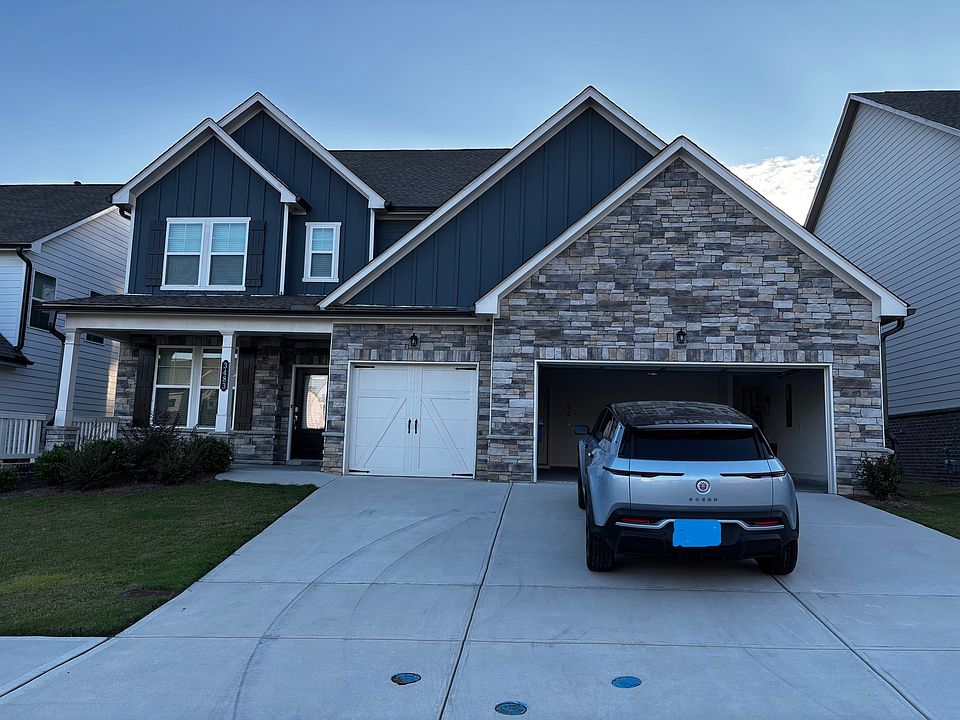 Front of home - 3 car garage and porch