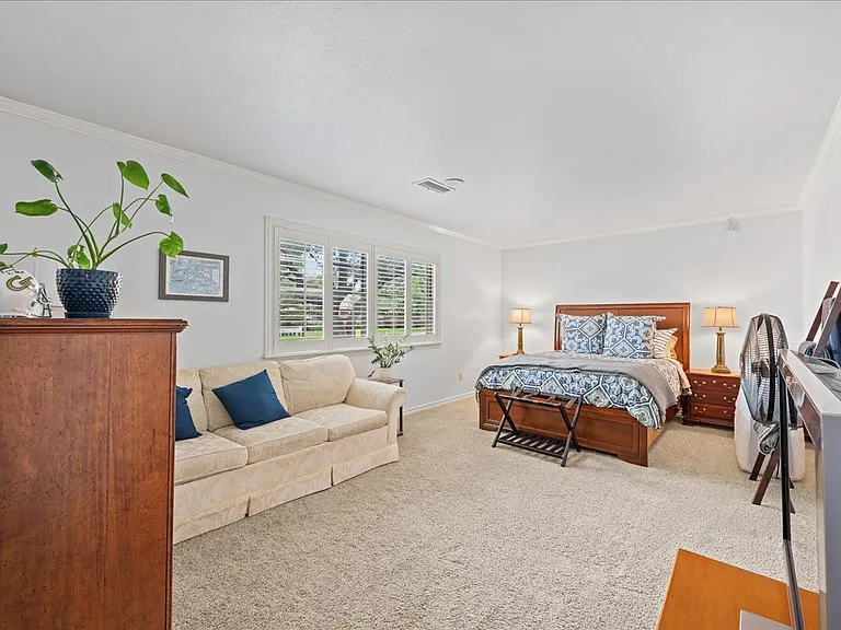 Formal living room currently used as guest bedroom