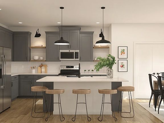 Kitchen with pendant lights quartz countertops