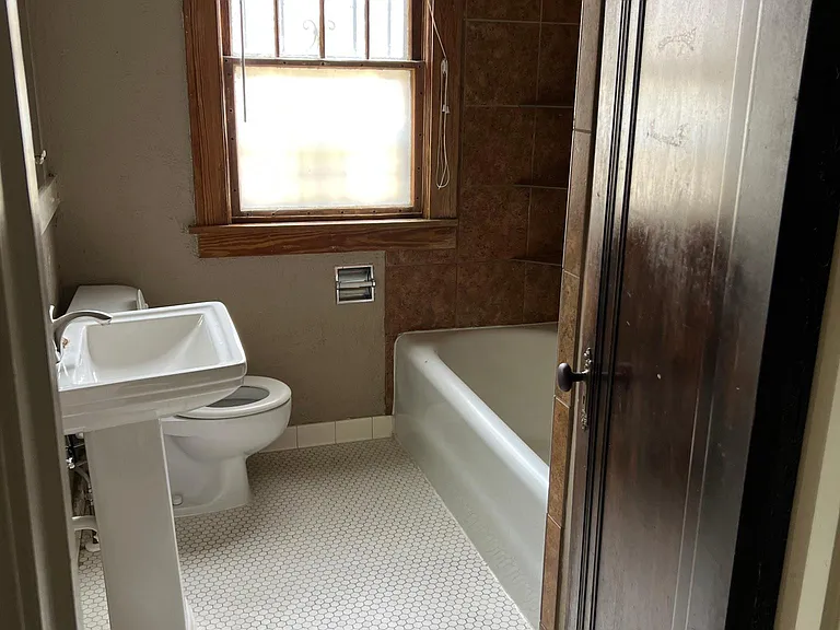 1st floor bathroom with original penny tile.
