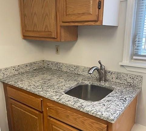 Brand new granite counter tops and kitchen sink & faucet.
