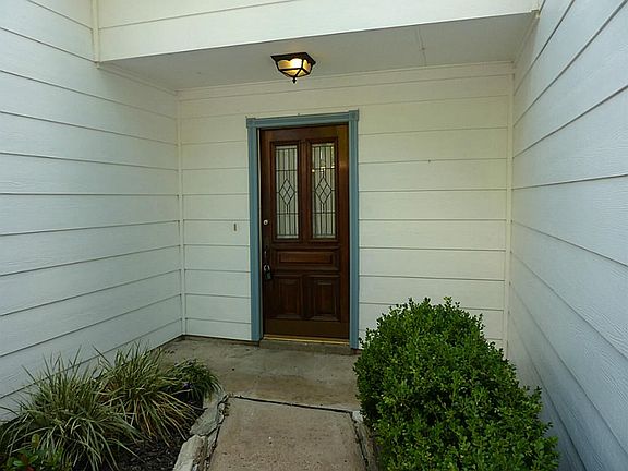 Front court yard with lead glass front door