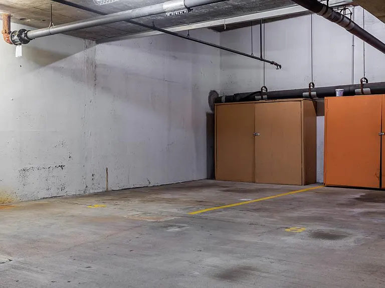 Parking space in the building's basement garage. Storage Locker with lock