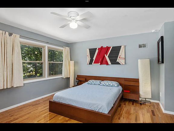 Primary bedroom that looks out to backyard