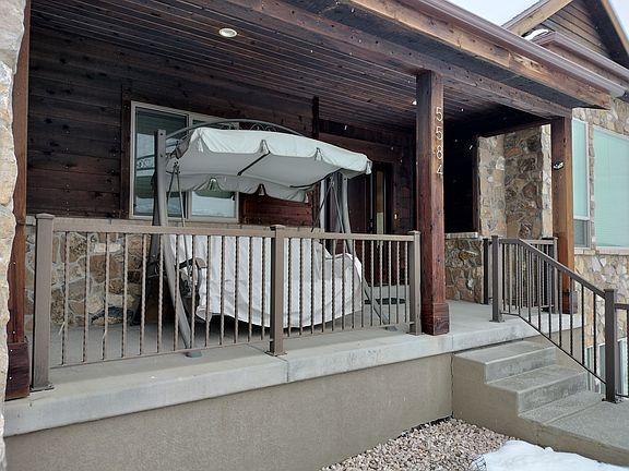 Enjoy relaxing on the swing overlooking the stunning Ogden Valley. Savor your favorite beverage and let the serene views create the perfect day.