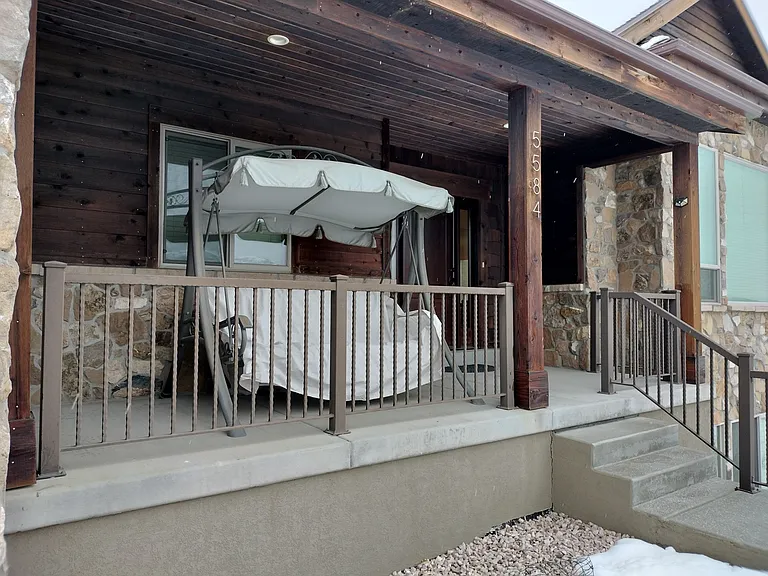Enjoy relaxing on the swing overlooking the stunning Ogden Valley. Savor your favorite beverage and let the serene views create the perfect day.