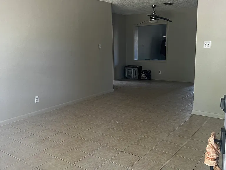 Leaving Room from Front Door Kitchen behind wall on the right