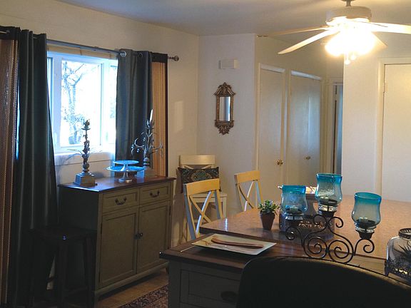 Kitchen with ceiling fan and side windows