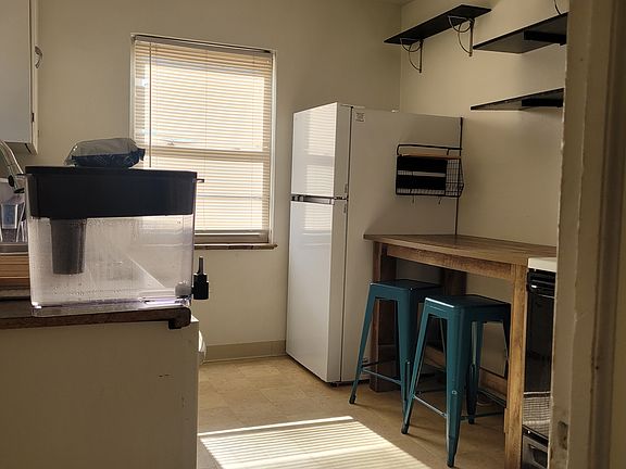Kitchen with new fridge.