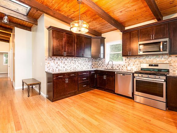 Brand New Kitchen From Ceiling To Floor Granite Countertops, Tiled Backsplash, All New Appliances, Bamboo Flooring and New Lighting Throughout
