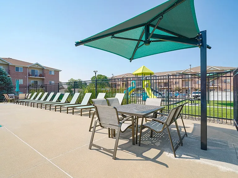 Take time to relax in the shade or grab a bite at our umbrella-covered table.