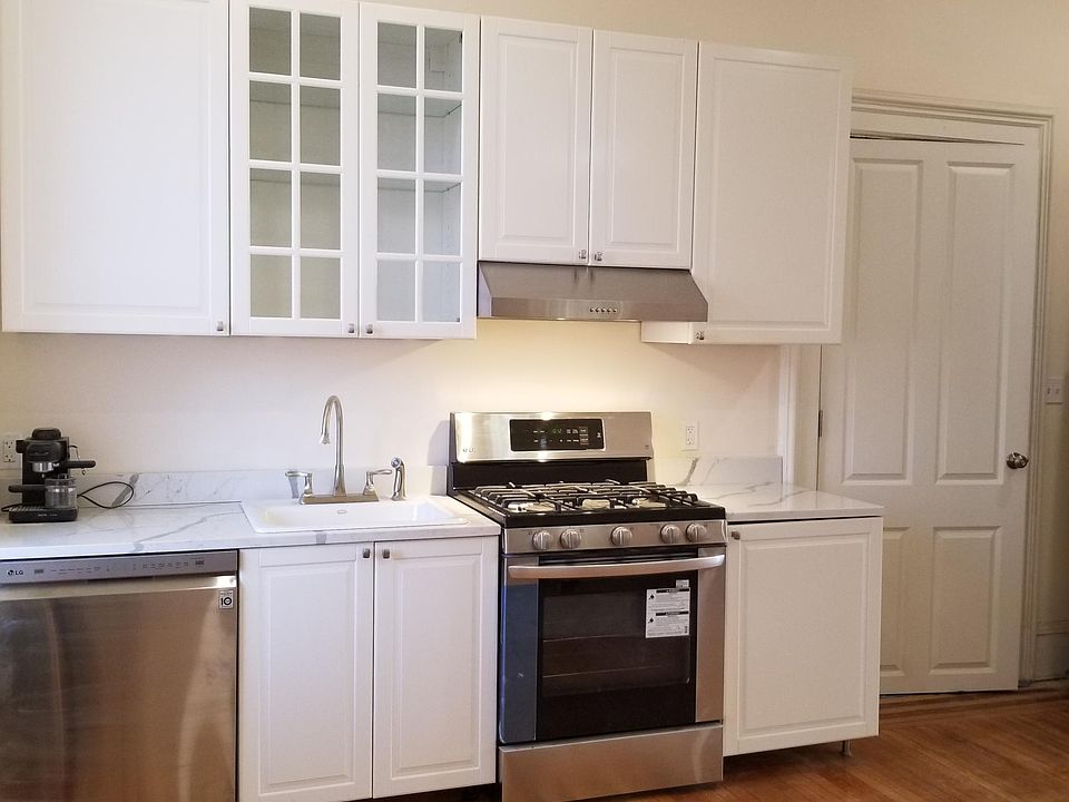 The cook's kitchen has new, energy-efficient, stainless steel appliances including a dishwasher, white quartz countertops and spacious, new cabinetry. Walk out the kitchen to the private 5'x20' deck for morning coffee or walk down into the 20'x75' landsc