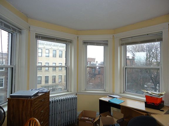 Plenty of natural light in living room, bay windows