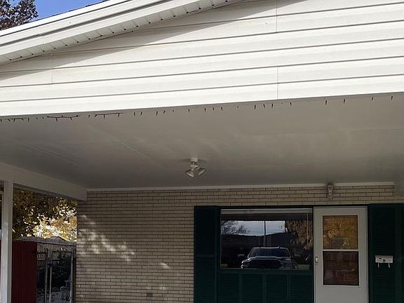 Front door, gate to side yard, patio and back door.