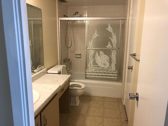 Bathroom with large walk in closet