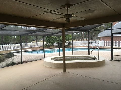 Jacuzzi inside screen porch