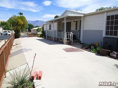 FRONTOF HOME FEATURES LARGE COVERED PATI