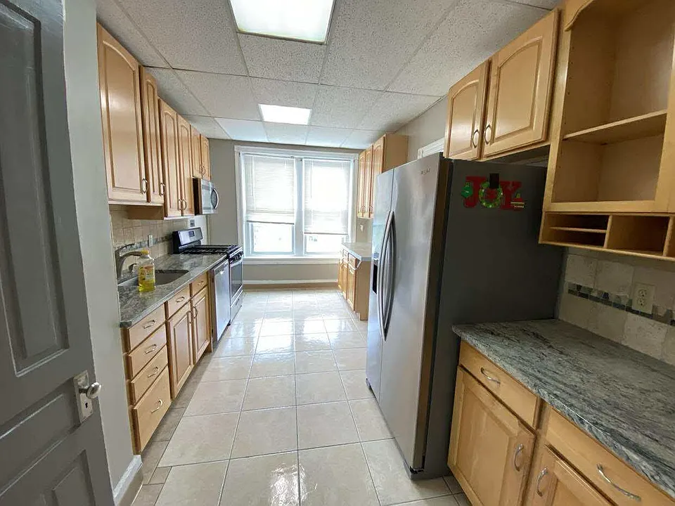 Modern kitchen with granite counter top. Dishwasher, fridge with ice maker. Also hook up for washer and dryer