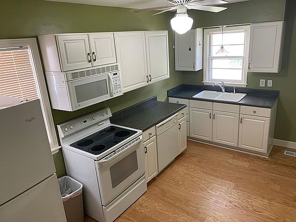 Kitchen with ceiling fan and plenty of cabinet space